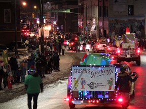 While spectators look on, the Pembroke Santa Claus Parade of Light winds its way through Pembroke's downtown core on Saturday night, Nov. 24, 2018.