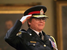 Kingston's new Chief of Police Ante McNeely salutes the Kingston Police Honour Guard after being sworn in as the new chief in a ceremony at Kingston City Hall on Friday November 30, 2018. The Whig-Standard/Postmedia Network