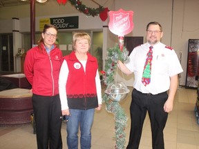 The Salvation Army Kettles opened their Christmas season on Monday, November 26 across the Northeast, (L to R) Captain Jennifer Robins, opening volunteer in Melfort Karen Duncan and Captain Rick Robins. File photo