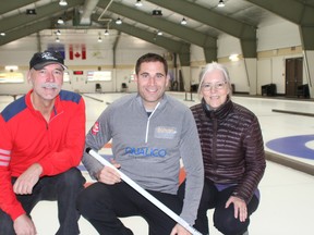 (Left to right) Rocky Mountain Curling Association's John Graham, two-time Olympic Curling gold medalist John Morris and Kathy Seifert pictured at the Canmore Golf & Curling Club after they announced the Qualico Mixed Doubles Classic on November 20. Photo credit Marie Conboy.