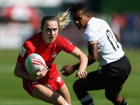 Julia Greenshields of Canada runs with the ball on Day 1 of the Emirates Dubai Rugby Sevens - HSBC World Rugby Sevens Series at The Sevens Stadium  on November 29, 2018, in Dubai, United Arab Emirates.  (Francois Nel/Getty Images)