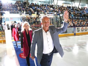 Former Sudbury Wolves player Rod Schutt and his wife, Rita, and daughters, Christen and Megan, walk onto the ice during a ceremony honouring Schutt prior to the Sudbury Wolves game against the Erie Otters on Nov. 2. Schutt's number was raised to the rafters.