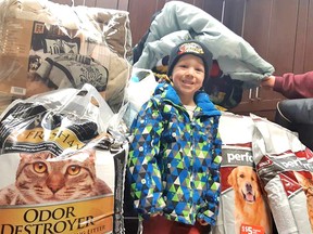 Bruno Lafond, 5, collected enough money to purchase four 40-pound bags of cat litter, dog and cat food, as well as plenty of toys and treats, which he delivered to the North Bay and District Humane Society. See page A3 for the story.
Submitted Photo