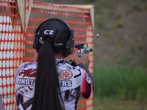 Rojin Altares, 16, fires her STI race gun at the targets during the International Practical Shooting Confederation of Canada Alberta Qualifiers, held at the Fort McMurray Fish and Game range, near Fort McMurray, Alta. on Sunday, June 18, 2017. Cullen Bird/Fort McMurray Today/Postmedia Network.