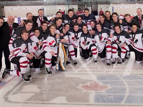 Spruce Grove Saints goalie Matt Davis and captain T.J. Lloyd led Team Canada West to bronze at the World Junior A Hockey CHampionships in Bonnyville on Dec. 16. Supplied