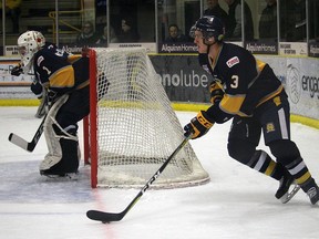 Evan Wood skates the puck up ice during the Saints 3-2 overtime loss to the Bonnyville Pontiacs