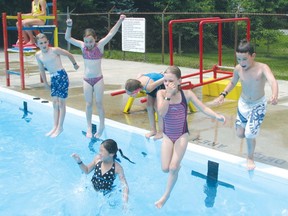 Kids jump into the water at Lions Pool in this Sentinel-Review file photo.