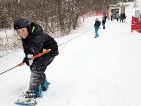 Theo Manson uses the pulley to go up to the top of the Big Ben Ski Hill followed by Sophie Morrizzi, Max Morrizzii and Campbell Manson. The municipally-funded ski hill opened for its first day of operation on Thursday January 3, 2019 in Cornwall, Ont. Alan S. Hale/Cornwall Standard-Freeholder/Postmedia Network