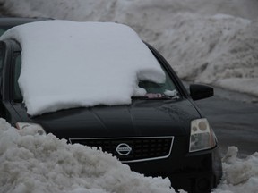 This car was one of the vehicles on the street when the plow came by. Postmedia
