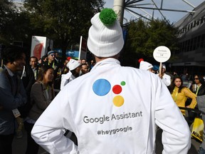 Attendees wait to ask a question of a Google Assistant last month at a giant "Hey Google" gumball machine game during CES 2019 at the Las Vegas Convention Center in Las Vegas, NV. Google Assistant is an artificial intelligence-powered virtual assistant which can engage in two-way conversations.