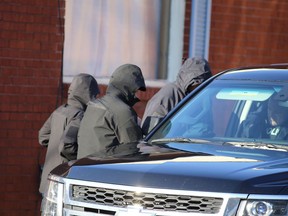 Police from Kingston and then the RCMP collect evidence at a home on MacDonnell Street in Kingston on Jan. 25, 2019, after revealing a terror plot was being organized from the home.