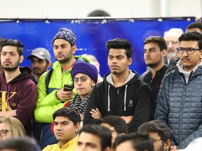 Students look on as Ahmed Hussen, Minister of Immigration, Refugees and Citizenship Canada, announced details of a pilot project at Cambrian College in Sudbury, Ont. on Thursday January 24, 2019. Hussen announced the creation of the Rural and Northern Immigration pilot project. John Lappa/Sudbury Star/Postmedia Network