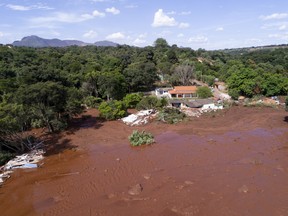 An aerial view shows flooding triggered by a collapsed dam near Brumadinho, Brazil, Friday, Jan. 25, 2019. (Bruno Correia/Nitro via AP)