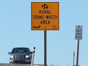 A rural crime watch sign reminds residents to be vigilant in a rural area of Alberta. The Parkland RCMP recently arrested a man for an alleged rural robbery.