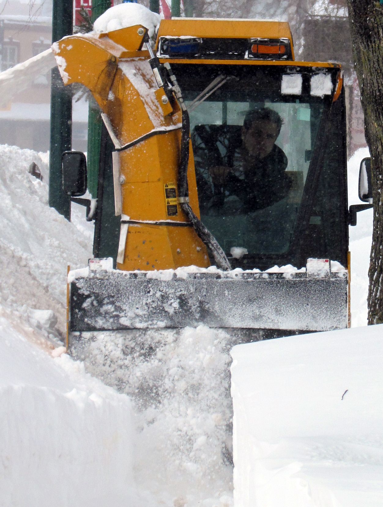 A sidewalk plow makes its way down Queen Street East during a snow storm. Jeffrey Ougler/Sault Star