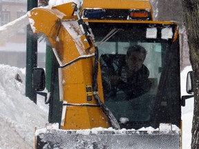 A sidewalk plow makes its way down Queen Street East during a snow storm. Jeffrey Ougler/Sault Star