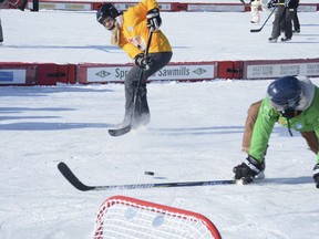 The green jerseys are forced onto defence by the yellows at the 11th annual Kimmett Cup at Mitford Pond on Feb. 9.