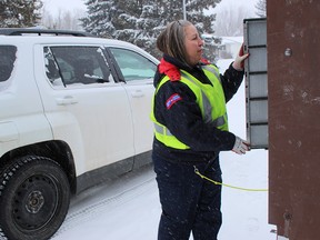 Courier Sheri Williams delivers mail to a community box in the Spruce Grove-Stony Plain area. The Parkland RCMP announced they are investigating recent mail thefts in each of the two communities. File photo