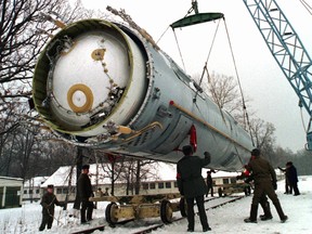 FILE - In this Dec. 24, 1997 file photo, soldiers prepare to destroy a ballistic SS-19 missile in the yard of the largest former Soviet military rocket base in Vakulenchuk, Ukraine. (AP Photo, File)