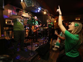The beer and songs were plenty as Celtic Kitchen Party performs at the Tir Nan Og Irish pub in downtown Kingston on St. Patrick's Day night in 2019. A new class order issued Thursday by Kingston, Frontenac and Lennox and Addington Public Health has nixed live music this year, shortened serving hours at pubs and capped gatherings indoors and out to five people.