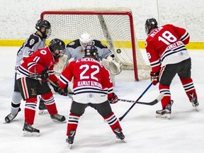 Sarnia Legionnaires forwards Nolan DeGurse (11), Alec DeKoning (22) and Isaac McLean (18) storm the LaSalle Vipers' net in the opening game of their GOJHL playoff series at Sarnia Arena in Sarnia, Ont., on Thursday, Feb. 28, 2019. (SHAWNA LAVOIE/Special to the Observer)