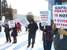 Homeowners take part in a protest against EcoLife Home Improvements on in 2019. The fraud case is still before the courts