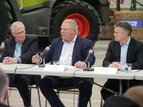 Ontario Premier Doug Ford, centre, with Ernie Hardeman, Minister of Agriculture, Food and Rural Affairs (left) and Rod Phillips, Minister of the Environment, Conservation and Parks, speaks to a roundtable of agriculture and agri-food leaders on the federal carbon tax. (Chris Abbott/Tillsonburg News)