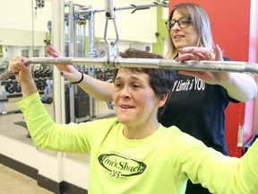 Erica Tucker helps Ellen MacDougall train at Sault Ste. Marie Family YMCA in Sault Ste. Marie, Ont., on Friday, March 22, 2019. (BRIAN KELLY/THE SAULT STAR/POSTMEDIA NETWORK)