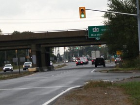 Vehicles on London Line pass underneath Highway 40 in Sarnia in autumn, 2018.