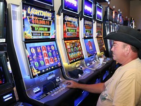 Gates Lachance plays the slot machines at Gateway Casinos Sudbury in this file photograph from 2017.