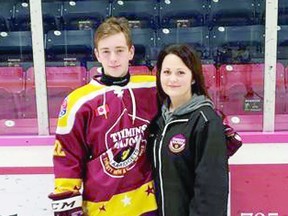 Skating coach Lisa Tremblay poses with player Desmond Brazeau of the Timmins Majors of the Great North Midget Hockey League.