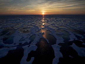 The midnight sun shines across sea ice along the Northwest Passage in the Canadian Arctic Archipelago, on July 22, 2017. Canada is warming up twice as fast as the rest of the world and that warming is "effectively irreversible" a new scientific report from Environment and Climate Change Canada says. That warming is happening even faster in the winter months, leaving southern Canadians with more winter rainfall and northern Canadians with melting permafrost and a shrinking sea ice. THE CANADIAN PRESS/AP, David Goldman