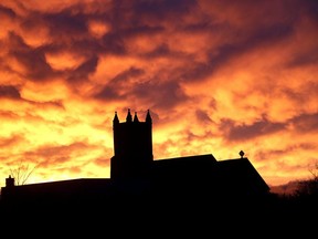 The setting sun and clouds form an unusual pattern over St. Mark's Anglican Church in Barriefield on May 1, 2017, after a heavy rain storm over Kingston.