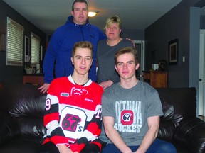 Sault Ste. Marie's Jack Matier dons his Ottawa 67's jersey in this family photo with his brother Tanner and his parents Mark and Stacey.