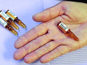 A public health nurse holds a vial of naloxone, a temporary antidote for narcotic overdose. A local group offers kits and training as public washrooms become ‘ground zero for overdose’.