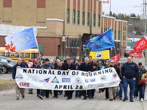 Members of the Timmins Labour Council and local union representatives are seen marching in a procession from the McIntyre Community Building during the National Day of Mourning for Workers that was held April 28, 2017.

File photo/The Daily Press