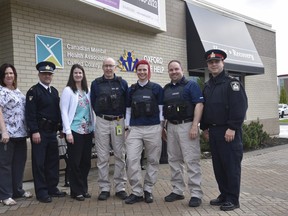 Mental health clinicians and police officers participating in the MHEART program, which started in September 2018. (Kathleen Saylors/Woodstock Sentinel-Review)