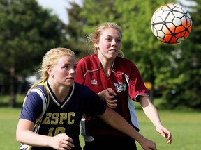 Pain Court Patriotes' Rachel Benn, left, battles North Lambton Eagles' Olivia White in the second half of the LKSSAA 'A' senior girls' soccer final at Ecole Secondaire de Pain Court in Pain Court, Ont., on Monday, May 27, 2019. Mark Malone/Chatham Daily News/Postmedia Network