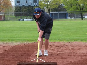 Third-baseman Austin Longchamps doing some groundskeeping at Cornwall Legion Park, on the eve of the long-awaited start of the season for the15U Royals. Photo on Friday, May 17, 2019, in Cornwall, Ont. Todd Hambleton/Cornwall Standard-Freeholder/Postmedia Network