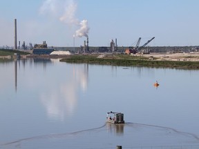 Syncrude workers in a recovery boat north of Fort McMurray Alta. on Friday June 19, 2015. Vincent McDermott/Fort McMurray Today/Postmedia Network