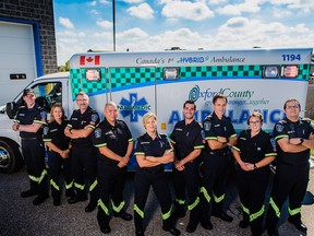 Oxford County Paramedic Service pose with the department's hybrid ambulance, the first of its kind in Canada. This year, the hybrid ambulances will make up 50 per cent of the department's fleet and there are hopes to expand even more to 100 per cent electric ambulances in the future.