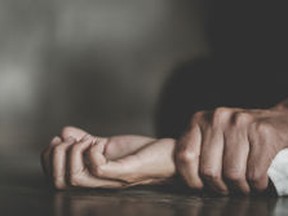 stock-photo-man-s-hand-holding-a-woman-hand-for-rape-and-sexual-abuse-concept-wound-domestic-violence-rape-1240921960
