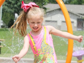 Jaylynn Principe-Leonard, 5, plays at Bellevue Park splash pad in Sault Ste. Marie, Ont., a year ago next week. POSTMEDIA NETWORK)