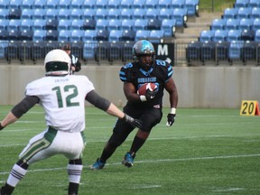 Monarchs running back Devon Stewart runs the ball up the field, trying to avoid the Airdrie Irish on Saturday, June 7, 2019. Laura Beamish/Fort McMurray Today/Postmedia Network