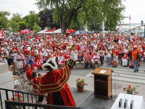 Kingston's Town Crier, Chris Whyman, rings in the start of the 2016 Canada Day civic ceremony outside City Hall in Kingston. Julia McKay/The Whig-Standard/Postmedia Network
