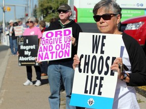 JEFFREY OUGLER 
Life Chain demonstration on Great Northern Road in October 2017.