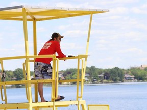A lifeguard surveys the main beach at Bell Park in Sudbury, Ont. on Monday June 17, 2019.