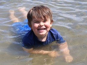 Bryson Elms, 4, cools off in Ramsey Lake at the main beach at Bell Park in Sudbury, Ont. on Monday June 17, 2019. Public Health will soon be testing the water quality of beaches in the Sudbury area.