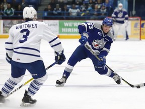 Liam Ross, right, of the Sudbury Wolves, attempts to fire a puck past Richard Whittaker, of the Mississauga Steelheads, during OHL playoff action at the Sudbury Community Arena in Sudbury, Ont. on Friday March 22, 2019. John Lappa/Sudbury Star/Postmedia Network