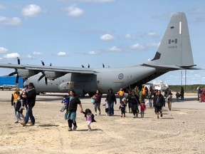 Hercules C-130 aircraft have been airliftng Pikangikum First Nation members out of the community to Sioux Lookout. Tim Brody/Sioux Lookout Bulletin